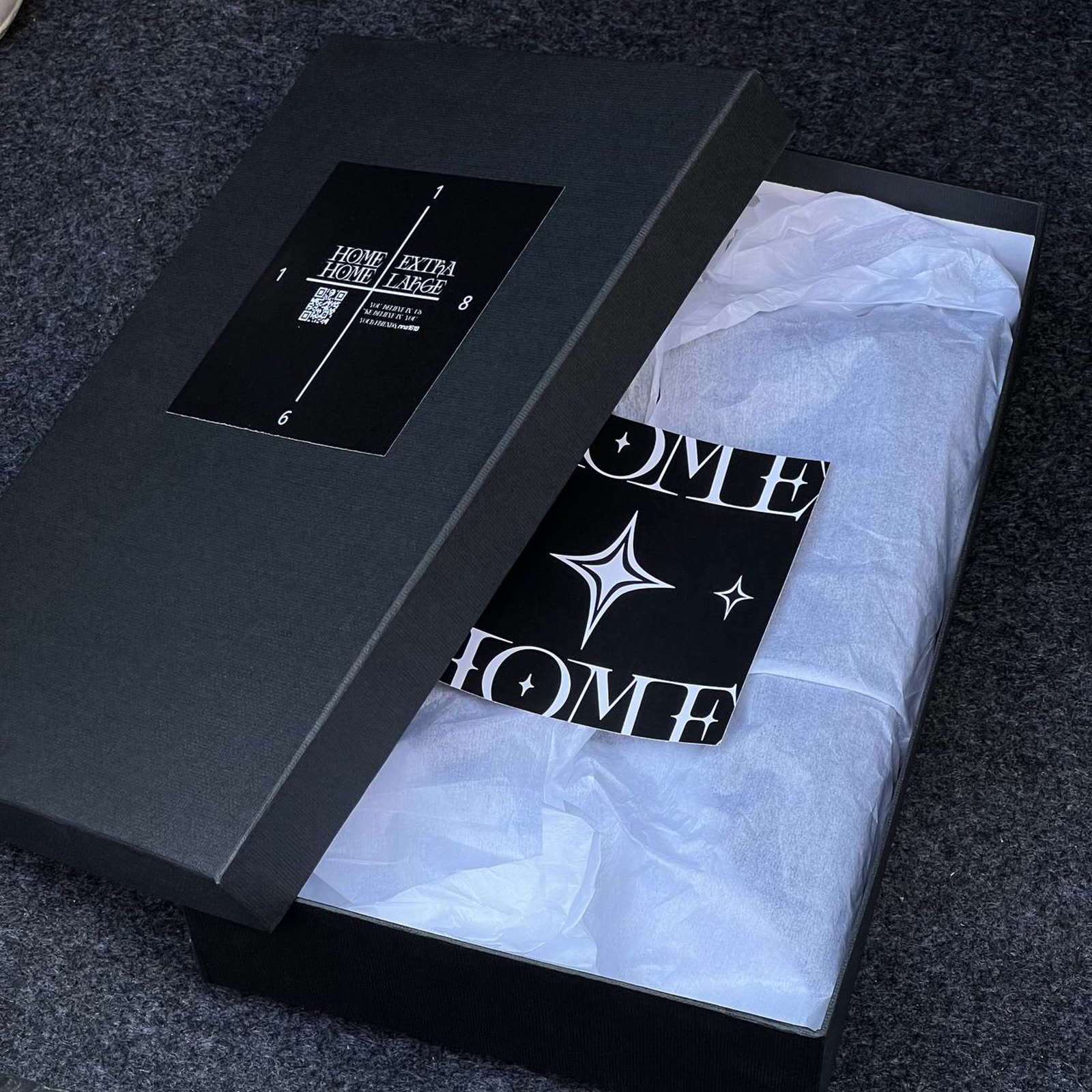 Black NNA1618 box with the 1618 quadrant label, tissue paper and HOME card inside