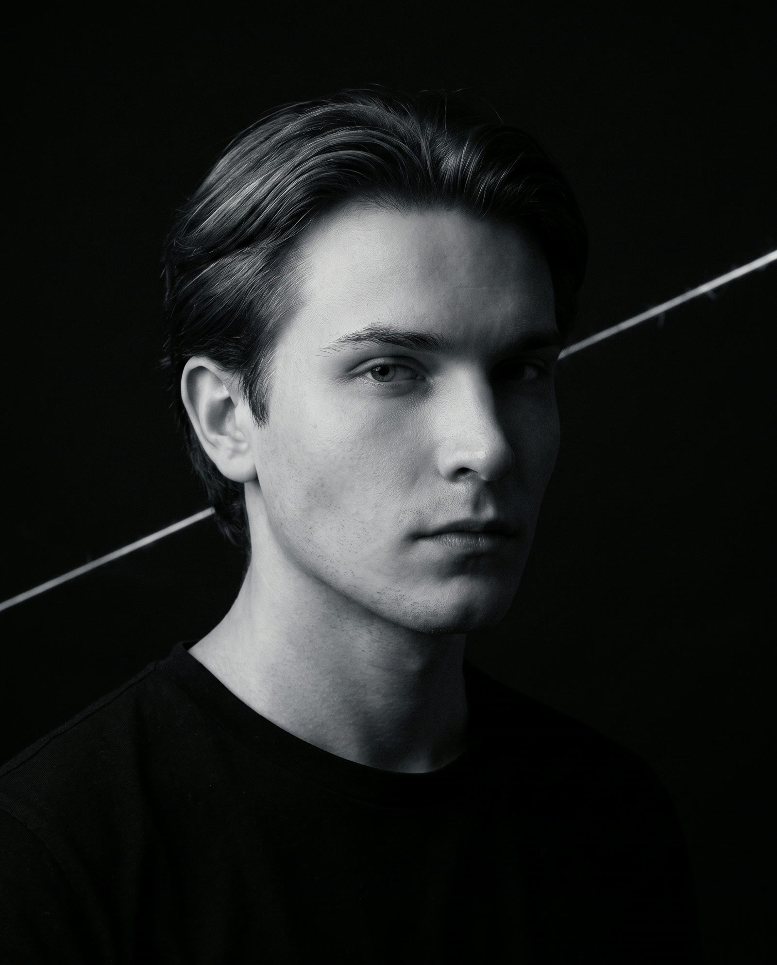Elijah: editorial portrait in near-darkness, the form side of the cluster